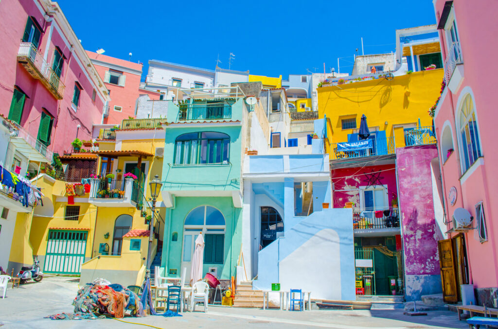 italian island procida is famous for its colorful marina, tiny narrow streets and many beaches which all together attract every year crowds of tourists coming from naples – napoli.